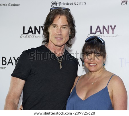 LOS ANGELES/CALIFORNIA - AUGUST 4, 2014: Ron Moss and Devin DeVasquez walk the red carpet at \