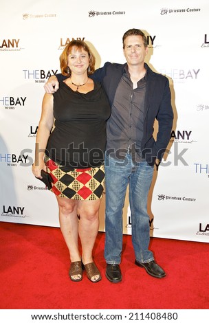 LOS ANGELES/CALIFORNIA - AUGUST 4, 2014: Screenwriter Aaron Pope & guest walk the red carpet at \