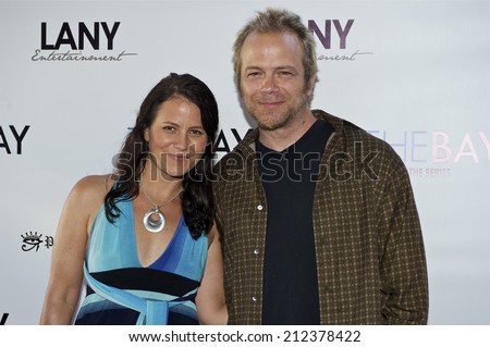 LOS ANGELES/CALIFORNIA - AUGUST 4, 2014: Actor Brian Gaskill & Guest walk the red carpet at \