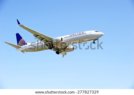 LOS ANGELES/CALIFORNIA - MAY 10, 2015: United Airlines commercial jet on approach to runway at Los Angeles International Airport in Los Angeles, California, USA