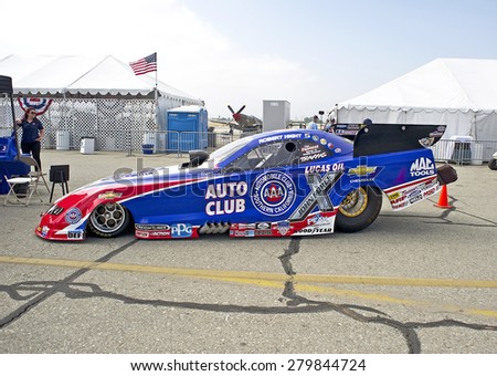 CHINO/CALIFORNIA - MAY 3, 2015: Auto Club of Southern California Chevrolet Camaro SS Funny Car (Robert Hight) on display at the Planes of Fame Air show in Chino, California, USA