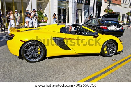 BEVERLY HILLS, CALIFORNIA - JUNE 21, 2015: 2015 McLaren sports car as it leaves the Rodeo Drive Concours D\' Elegance on June 21, 2015 Beverly Hills, California, USA