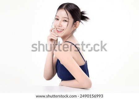 Beautiful young Asian woman with K beauty style makeup and perfect skin on isolated white background. Facial and skin care concept for commercial advertising.