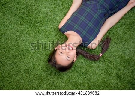 Similar – Image, Stock Photo Little girl laying playing on grass enjoying summer day during vacation trip