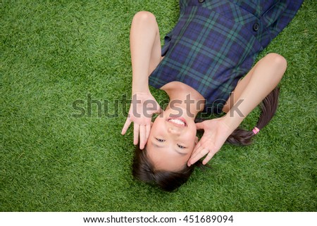 Similar – Image, Stock Photo Little girl laying playing on grass enjoying summer day during vacation trip