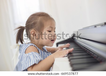 Similar – Image, Stock Photo Child practicing piano