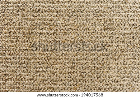 Knitted fragment of yellow carpet