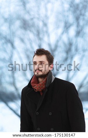 Handsome man looking ahead, winter day