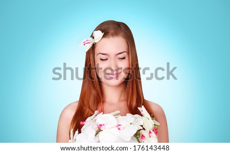 Beautiful young woman cute smiling in flower dress and with white flower in their hair