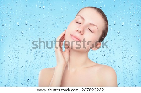 Beauty woman, skin care and freshness background with splash water drops, female portrait enjoying clean skin