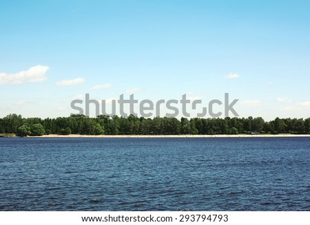 Sea and blue sky background, long distance land, beach and vegetation