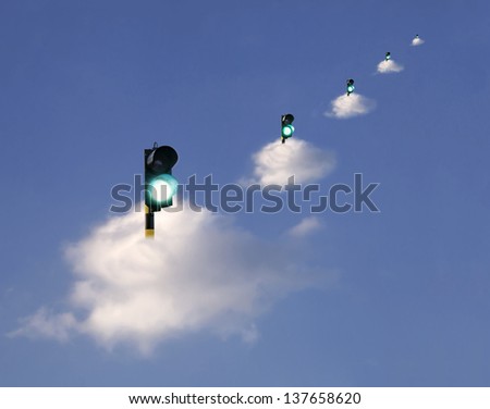 Green traffic lights floating on clouds, suggesting receiving the go ahead ,  permission of safety