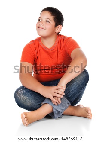 Young Caucasian Boy Wearing An Orange T-Shirt And Blue Jeans. The Boy ...