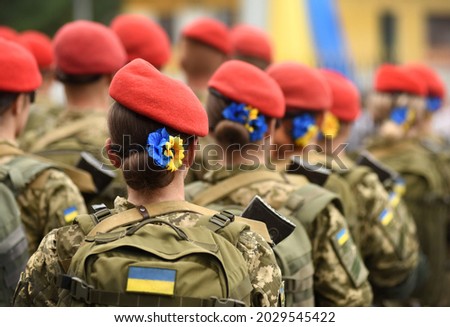Woman soldier. Woman in army. Ukrainian flag on military uniform. Ukraine troops. Stockfoto © 