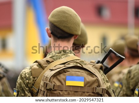 Ukrainian soldier. Ukrainian in army. Ukrainian flag on military uniform. Troops of Ukraine. Сток-фото © 