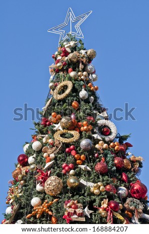 Beautiful Christmas tree over light-blue sky