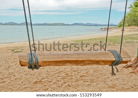 Wood swing and soft sand beach