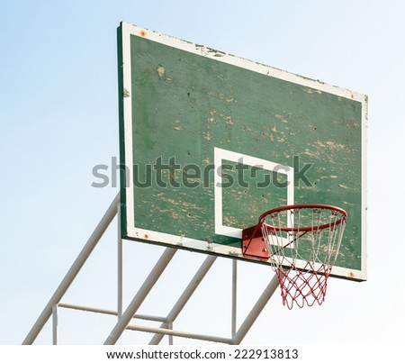 Basketball hoop on green wood and white iron structure base