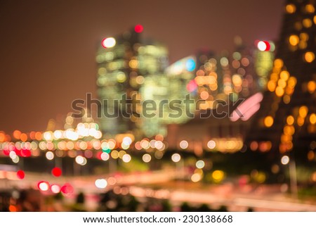 Defocused lights and building of big city in night time