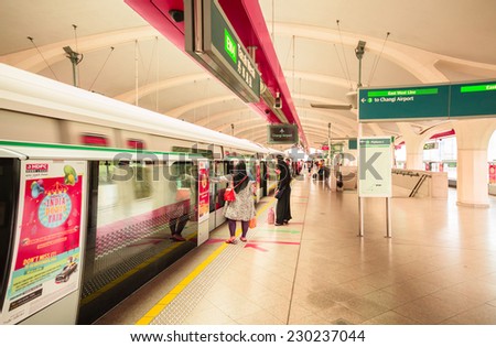SINGAPORE - NOVEMBER 2 :Unidentified people are waiting for MRT at Tanah Merah Station on November 2,2014.MRT is a rapid transit system forming the major component of the railway system in Singapore.