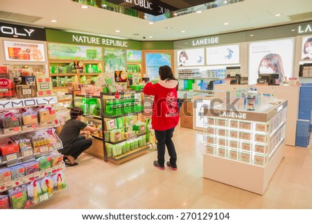 SEOUL,SOUTH KOREA - APRIL 14, 2015 : The cosmetic shops inside of Dongwha duty free Department store in Seoul. There are lots of fashion shops i.e. cloths, cosmetic, watch etc.