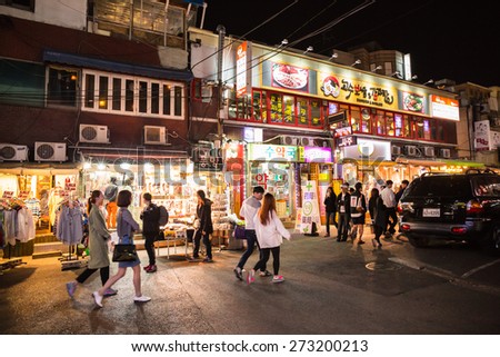 SEOUL, SOUTH KOREA - APRIL 14 : People are shopping and walking in walking street night time in downtown on April 14,2015 in South Korea
