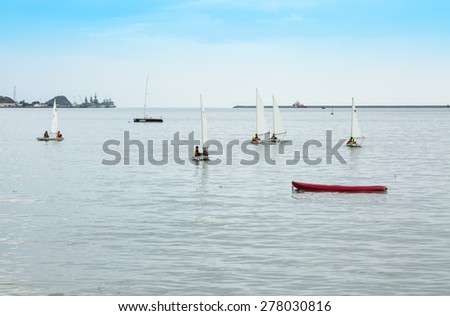 CHONBURI,THAILAND - MAY 14 : The group of student are training sailing in the sea at Sattaheep bay in Chonburi province,Thailand on May 14,2015.