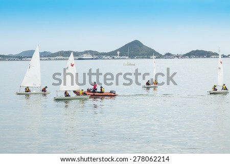 CHONBURI,THAILAND - MAY 14 : The group of student are training sailing in the sea at Sattaheep bay in Chonburi province,Thailand on May 14,2015.