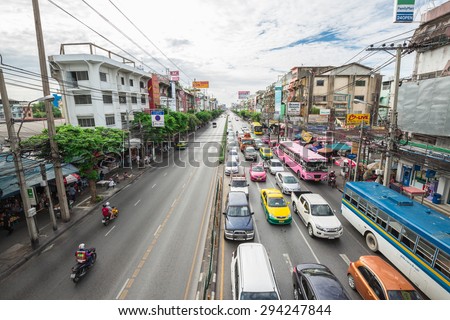 BANGKOK,THAILAND - JULY 6:Traffic road with motorcycle ,cars, buses, taxis and people at down town of Bangkok,Thailand on July 6,2015.