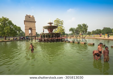 NEW DELHI, INDIA - AUGUST 4: The pond and Indian gate   are in New Delhi,India on August 4, 2015. The Indian gate is the national monument of India.