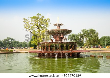 NEW DELHI, INDIA - AUGUST 4: The fountain and children at Indian gate in New Delhi,India on August 4, 2015. The Indian gate is the national monument of India.