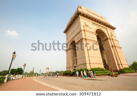 NEW DELHI, INDIA - AUGUST 4: The Indian gate and tourists are in New Delhi,India on August 4, 2015. The Indian gate is the national monument of India.