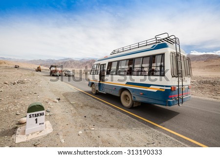 LEH LADAKH , INDIA - AUGUST 11 : The bus is on Indian Himalayas high altitude road in Leh Ladakh,India on August 11, 2015.
