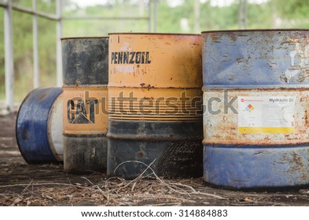 PATTAYA,THAILAND - SEPTEMBER 9 : The old fuel and oil tanks in old garage at September 9, 2015 in Pattaya,Thailand