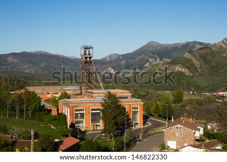 Ancient facilities of mine today closed in mountainous scenery. Central headframe castillete of the well of mine. Sotillos. LeÃ?Â³n. Spain