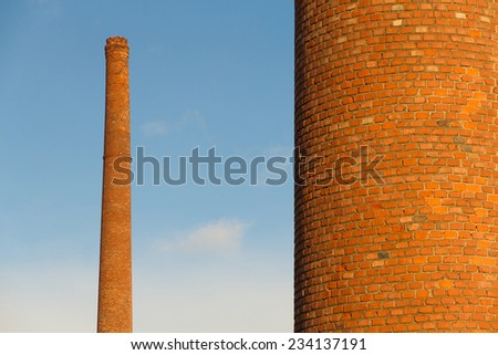 Old brick factory chimneys built in bricks and tiles, Light of Dawn