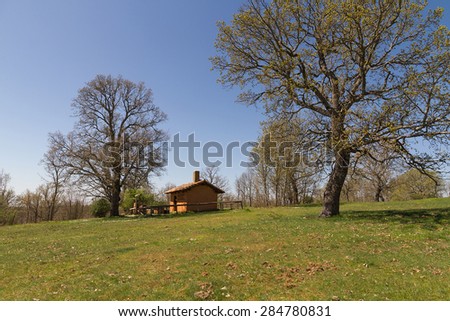 Adobe hut on the mountain  - Cottage, cabin or hunting lodge built in adobe, in a forest meadow oak