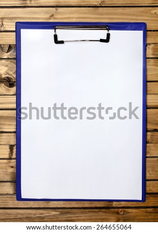 blank clipboard on wood background