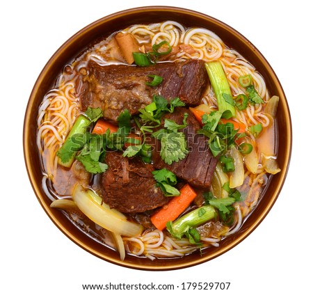 A beef noodle soup bowl isolated white