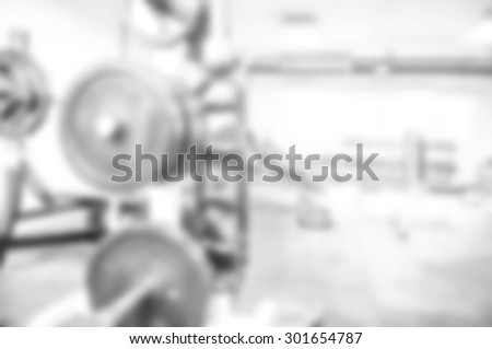 blurred image of black and white gym for background - healthy fitness club clean center