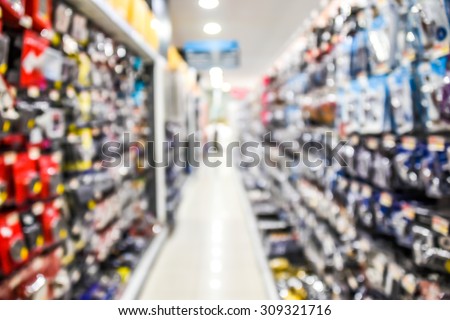 blurred image of hardware supplies in shop - blur background concept