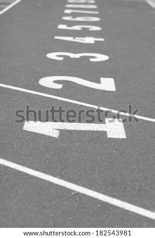 Back and White Start track. line on a red running track