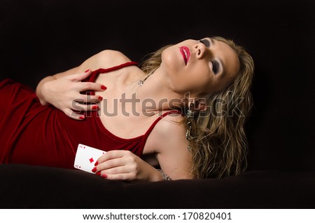 Woman in red with playing card