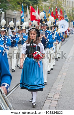 ZURICH - AUGUST 1: Swiss National Day parade on August 1, 2011 in Zurich, Switzerland. Woman in a historical costume.