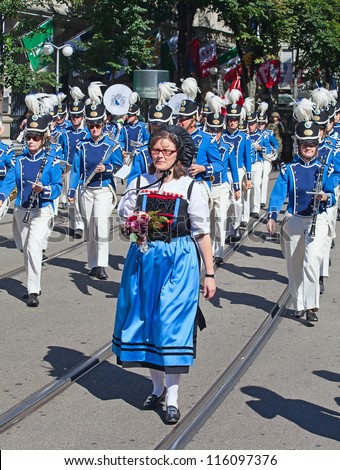 ZURICH - AUGUST 1: Zurich city orchestra in national costumes openning the Swiss National Day parade on August 1, 2012 in Zurich, Switzerland.