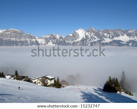 Skiing above the clouds in Flumserberg (St. Gallen, Switzerland)