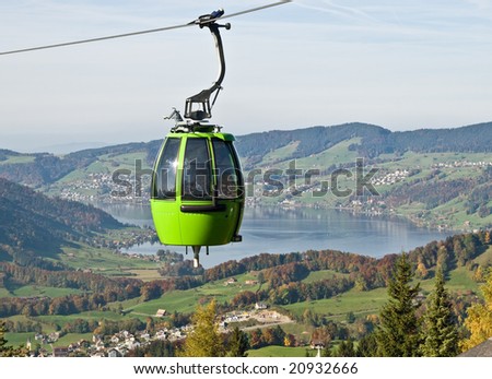 Cable car above autumn forest