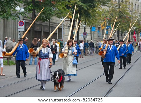 ZURICH - AUGUST 1: Swiss National Day parade on August 1, 2009 in Zurich, Switzerland. Musicians marching with traditional swiss alphorns