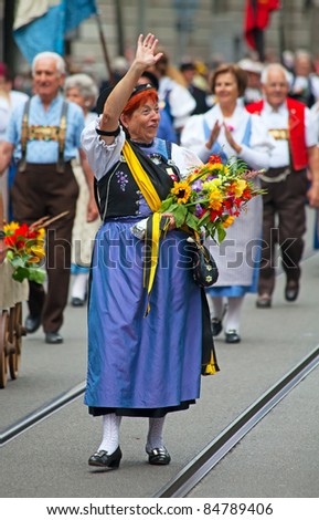 ZURICH - AUGUST 1: Unidentified woman in a historical costume at Swiss National Day parade on August 1, 2009 in Zurich, Switzerland.