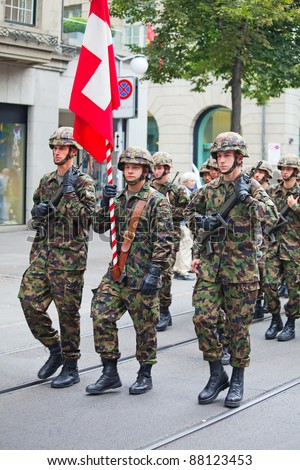 ZURICH - AUGUST 1: Infantery division of Swiss army marching in the Swiss National Day parade on August 1, 2009 in Zurich, Switzerland.